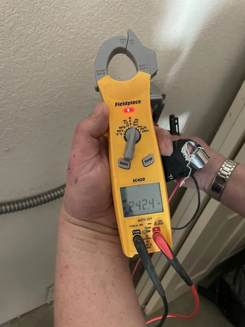 Voltage testing with clamp meter during Generator Installation in Mount Pleasant